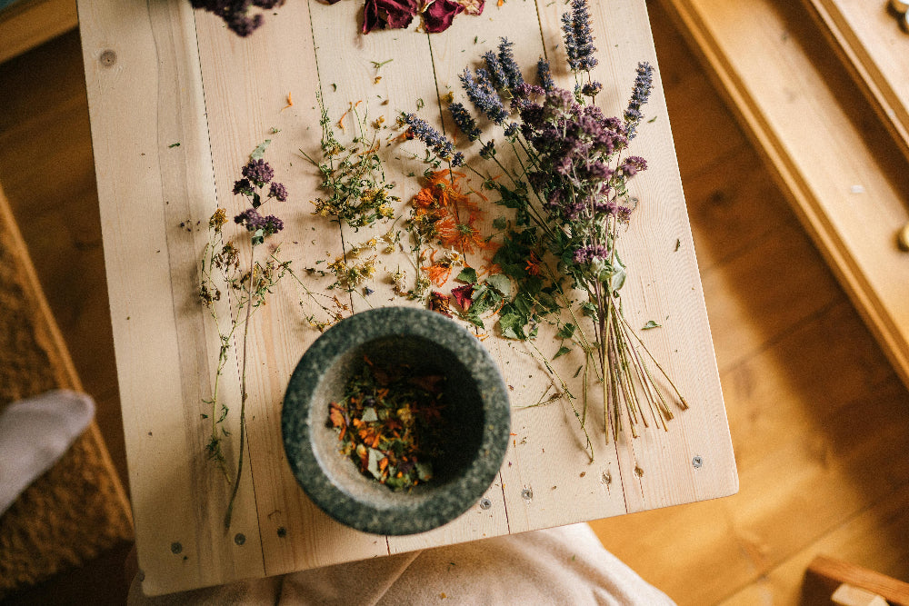 A bowl of ancient herbs and natural remedies, symbolizing traditional healing and the natural ingredients crafted into Zororra’s wellness formulas.