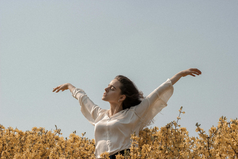 A peaceful woman embracing nature, reflecting Zororra’s philosophy of natural healing, inner calm, and holistic wellness.