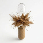 AshwaCalm+ capsule illustration, powder bursting from an opened capsule